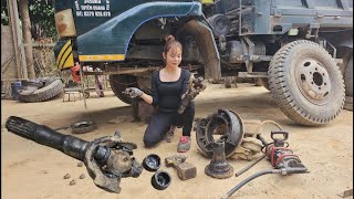 : Mechanic girl replaces front axle cross ball for truck