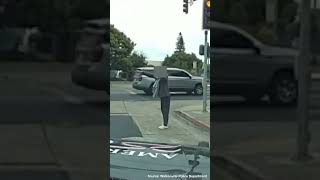 Police Confront Man Screaming and Swinging Two Knives Around