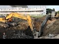 Excavator Digging Concrete Tower Foundation