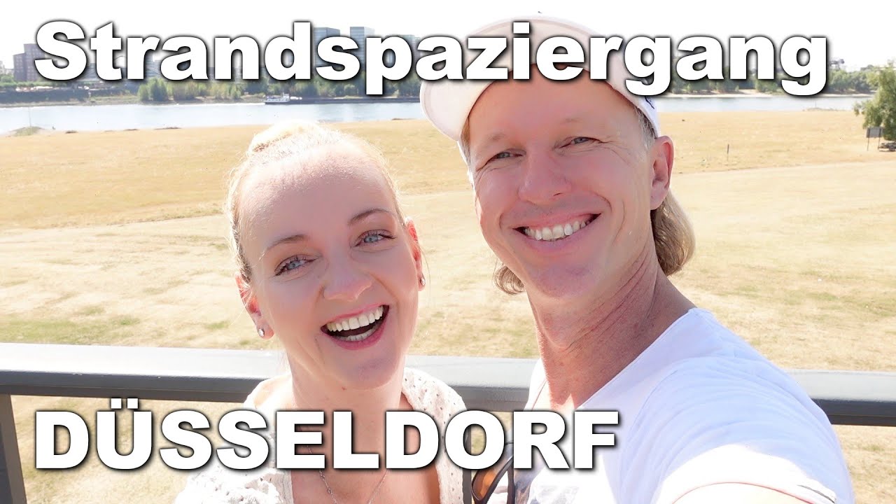 Düsseldorf - Strandspaziergang bei Niedrigwasser am Rhein. Pegeluhr an der Rheinpromenade