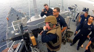 Navy Captain and Sailors Shoot Ship's Machine Guns