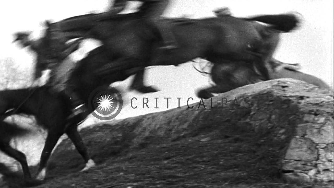 King Victor Emmanuel III watches horsemen making their horses cross the obstacles...HD Stock Footage