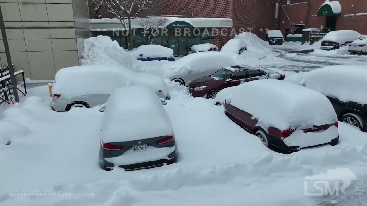 1-17-2022 Buffalo, Ny Drone shots of heavy snow blanketing the City, cars buried, people digging out