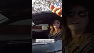 Woman accused of driving with phone in missing hand