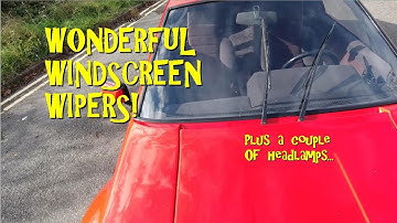 Windscreen wipers in action. Lots of them! Windshield, rear and headlamp