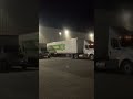 “Backing tractor trailer in dock between two…”