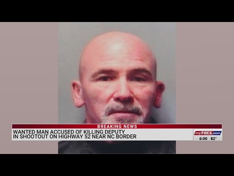 Wanted man accused of killing deputy in shootout on US 52 near North Carolina border