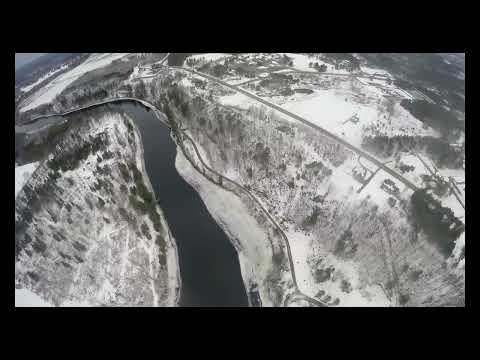 A still from the video Helicopter Flight Over Michigan (Giant Sinkhole Included) by Jason Asselin