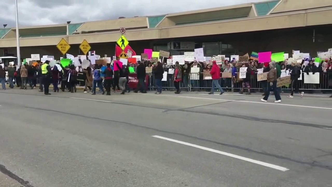 Protesters picket immigration ban at KCI