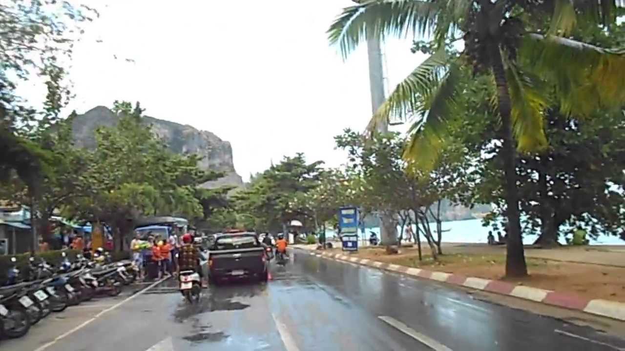 Ao Nang Krabi Thailand during Songkran (Thai New Year) from a motorcycle. Motor scooters in Thailand