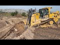 Caterpillar d9t bulldozer working on huge mining area