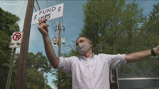 Metro Atlanta protesters demand Congress fund USPS