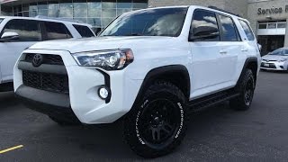 2016 toyota 4runner sr5 v6 standard package in "alpine white." mods:
blacked out front grille, badging, fenders, mirrors, roof rails and
cross bars. 6000k hi...