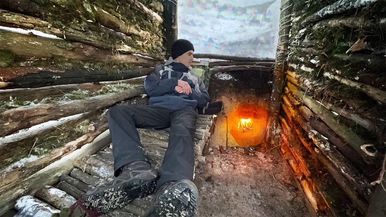 Building a Warm and Cozy Bushcraft Shelter in the Forest - YouTube