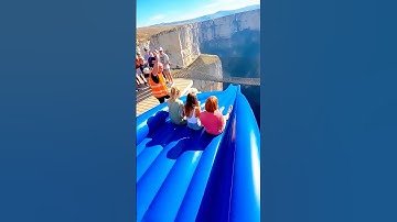 3 people slide—into net over abyss?! 😱🔥 Is it safe? #CliffSlide #ExtremeGroup