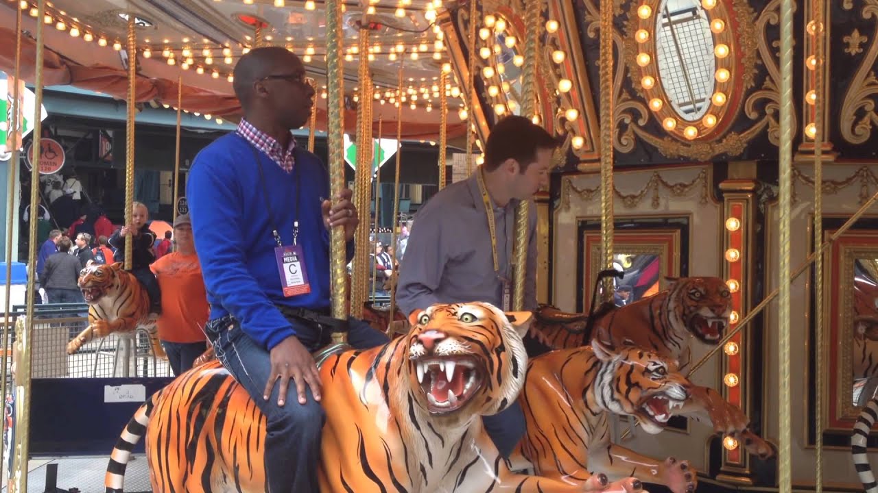 Salk & Holley ride a tiger carousel 