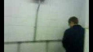 Inflatable Bat Whacking Guy In Toilet