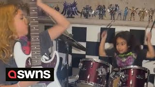 Young siblings rock out on drums and guitar  aged ten and eight | SWNS