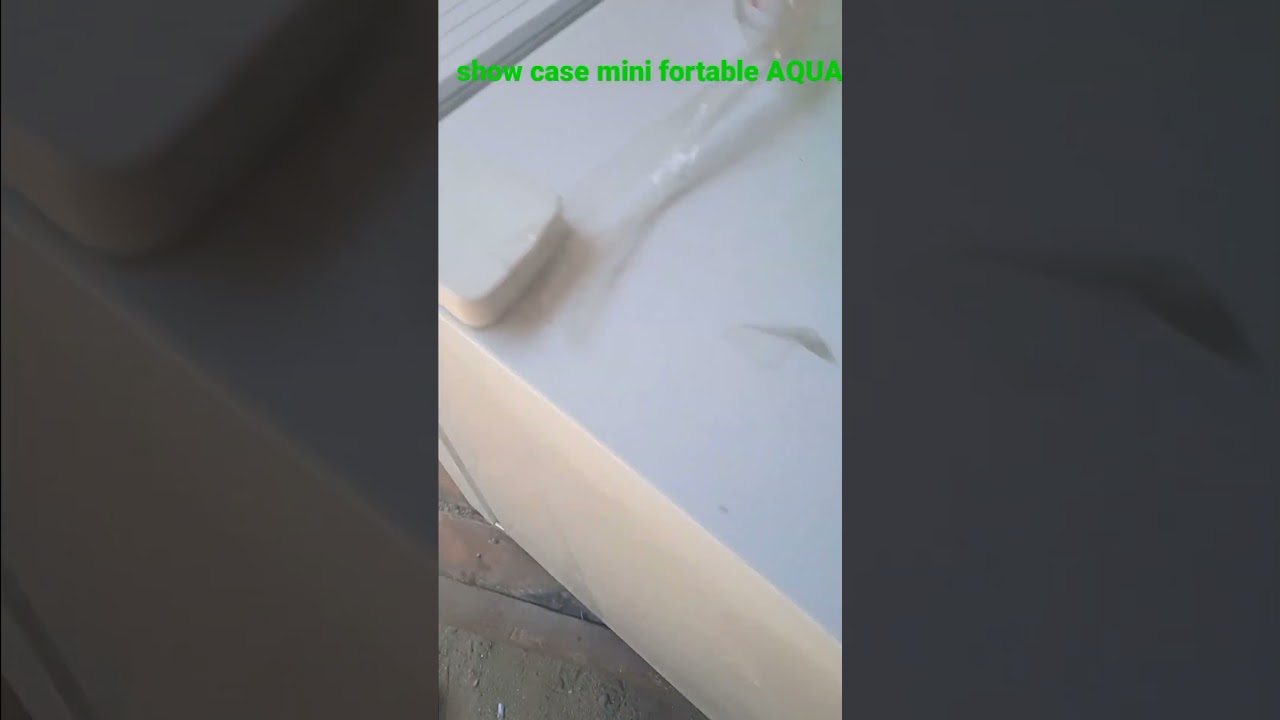 Kulkas mini portable  AQUA tidak dingin