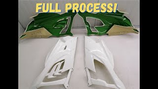 Making fiberglass BMW M1000RR race fairing winglet side panels.