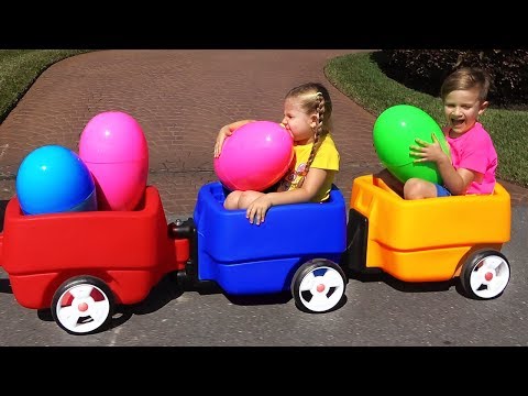 Diana and Roma playing with HUGE EGGS Surprise Toys