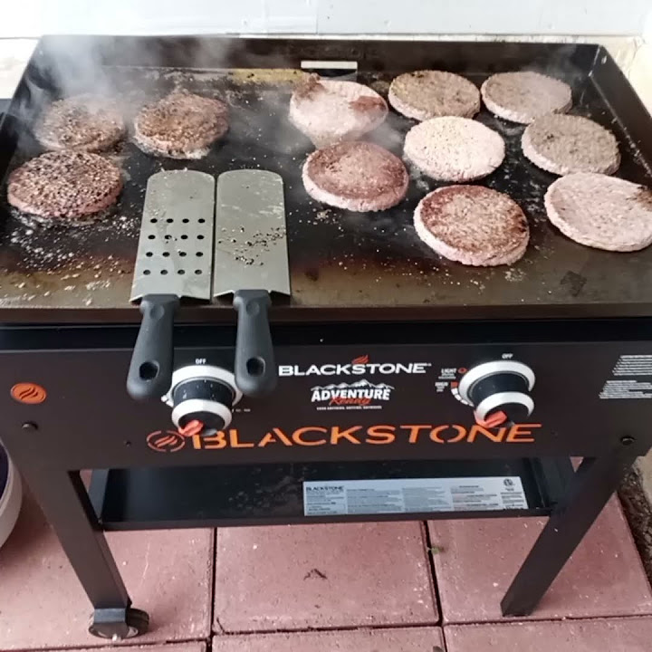 Cooking frozen hamburger patties on the Blackstone griddle in Bismarck