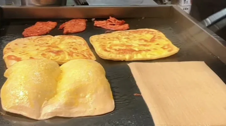 "Freshly poured egg filling, hot pancake aroma filling the air"