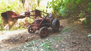 70 year old David Brown Tractor fixing road after 50 year flood..