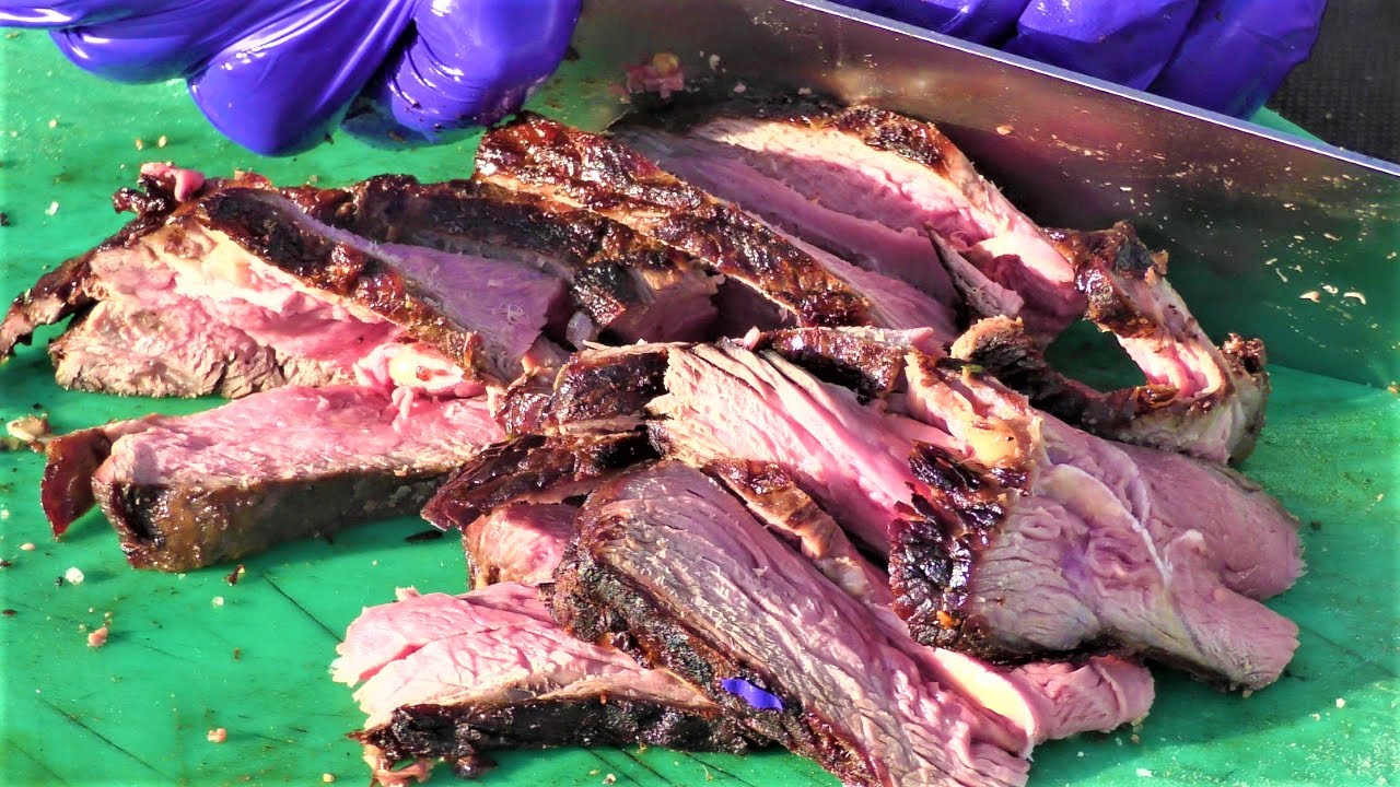 ⁣Street Food in Valencia, Spain. Grilling and Cutting Huge Blocks of Beef. Meat Carnival 2022