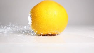 Orange Falling On Wet Surface  Stock Video