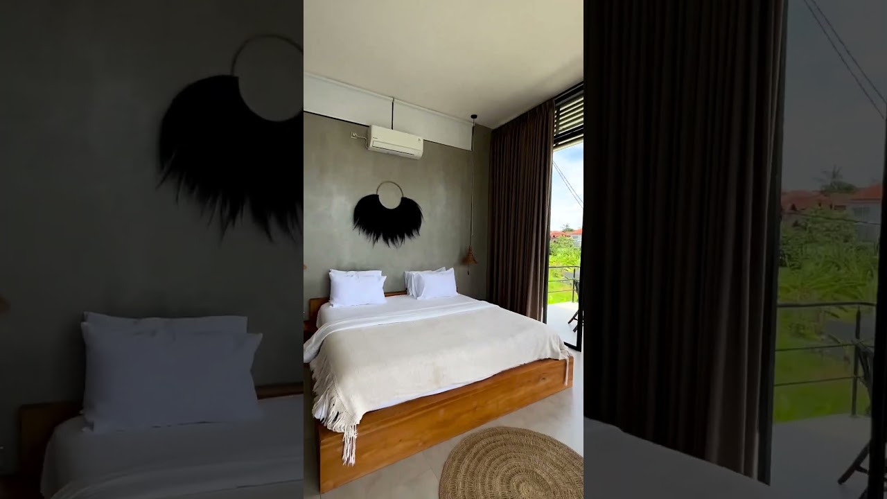 @villakamalbali Experience a stunning pool and sunset rooftop with high ceilings