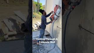 how to cut through a solid concrete wall. #shorts #construction #renovation #howto #concrete