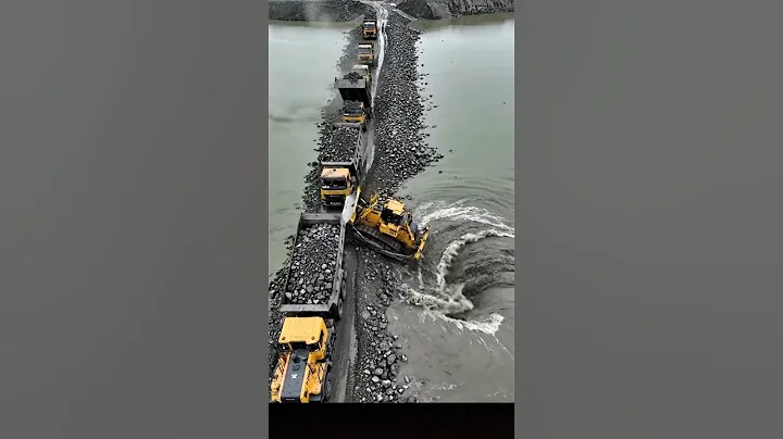 Massive Bridge Construction: Dump Trucks & Dozers Building Embankment Over Water