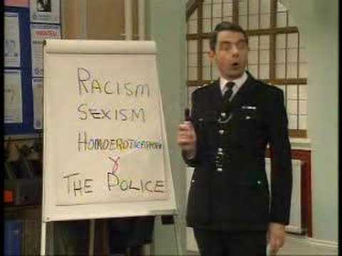 In part 2: The mayoress gives Inspector Fowler a lecture about the need for his officers to be un-racist and un-sexist, Fowler responds by holding a discussion about an article by Sir Paul Condon. (A name which highly amuses Constable Goody.) With Rowan Atkinson, James Dreyfus, Mina Anwar and Mark Addy. | The Thin Blue Line - "Ism Ism Ism" (2/5)