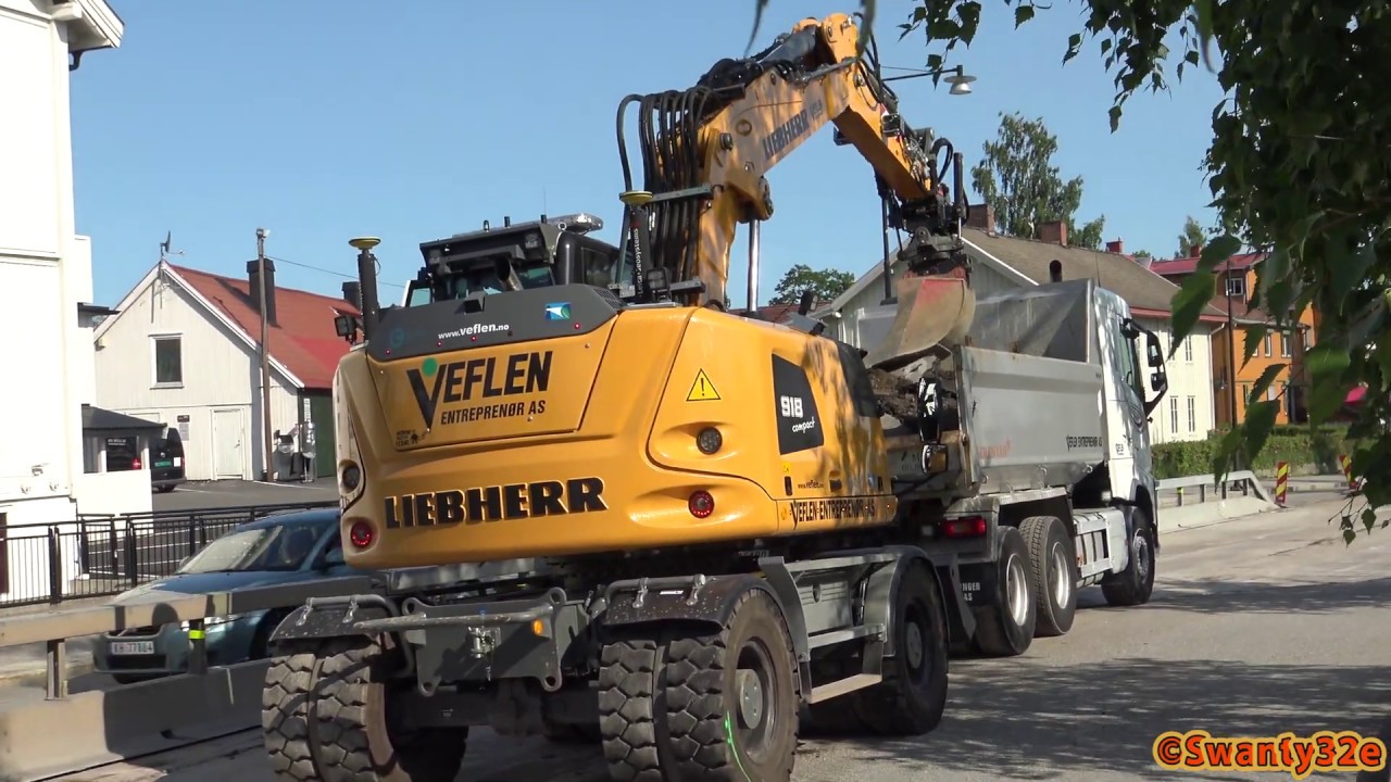 4K| Liebherr 918 Compact Digging, Ripping And Loading Asphalt On A Volvo FH 540 6x4