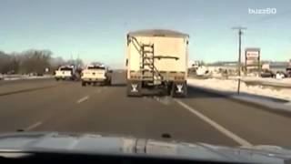 Police officer jumps into moving semi-truck to save driver