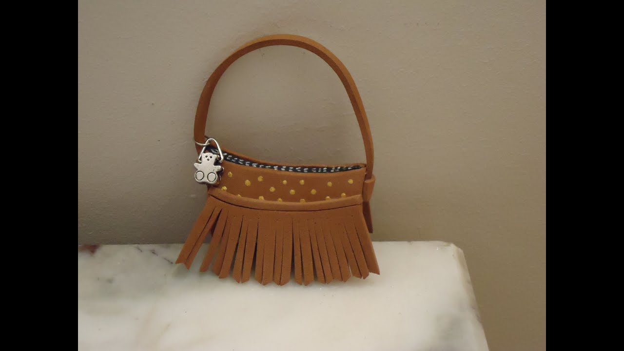 Bolso marron con flecos