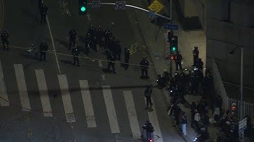 Lingering protesters face off with LAPD hours after 
