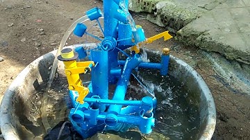 Guồng nước giả gạo bằng chân chẻ củi quá đẹp