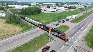 Awesome Aerial 4K View! Local Train CN 537 Crossing Trans Canada Highway X-ing near Moncton, NB
