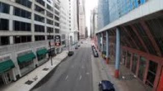 Nearly empty elevated trains circle Chicago Loop