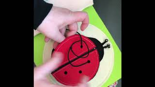 Ladybug lacing and zipper page for the TinyFeats Quiet Book