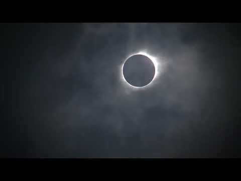 Total solar eclipse emerges from behind clouds in Nebraska
