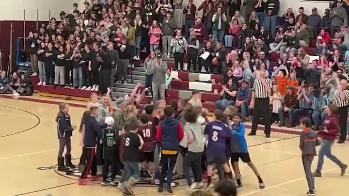 Patrick Thibodeau sinks a half-court shot