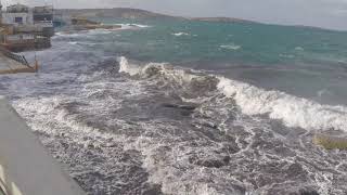 Water sea strong waves hit shoreline dirty foam swirls