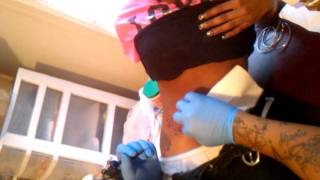 Lucy getting her tattoo