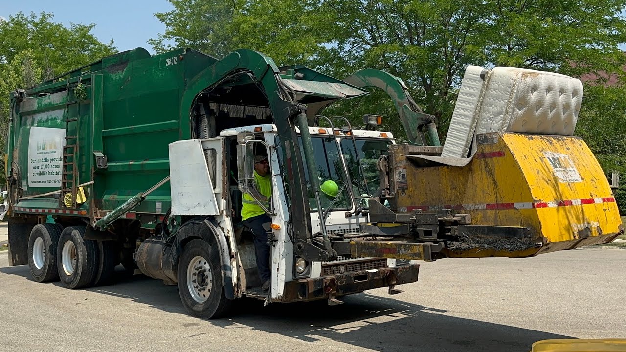 Waste Management Mack LE Curotto Can Garbage Truck Packing a Mattress