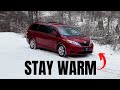 Minivan Camper Staying Warm in a Winter Snow Storm