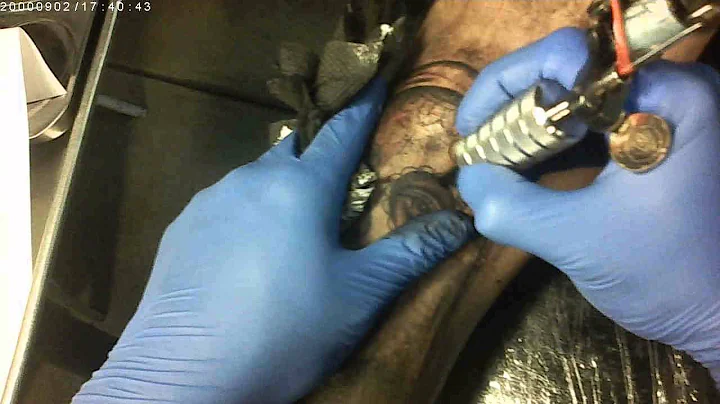 Alex Kuo of AK irons tattooing day of the dead gir...