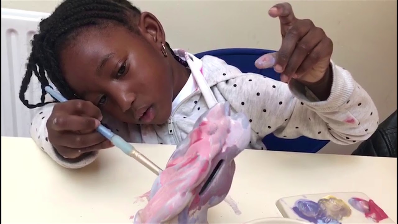 Alayah Paints Multicolour Unicorn at the Pottery Cafe